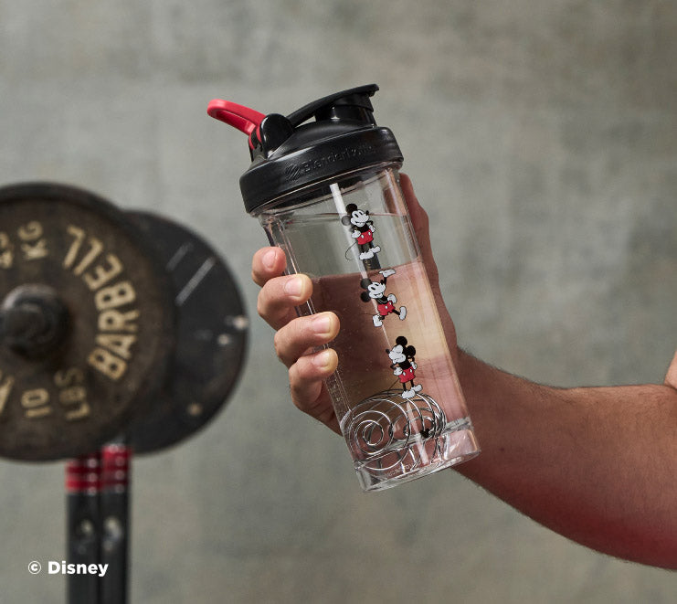 pro-series-l5 Mickey_Mouse_Protein_Shaker_Bottle_Being_Held_In_the_Gym.jpg